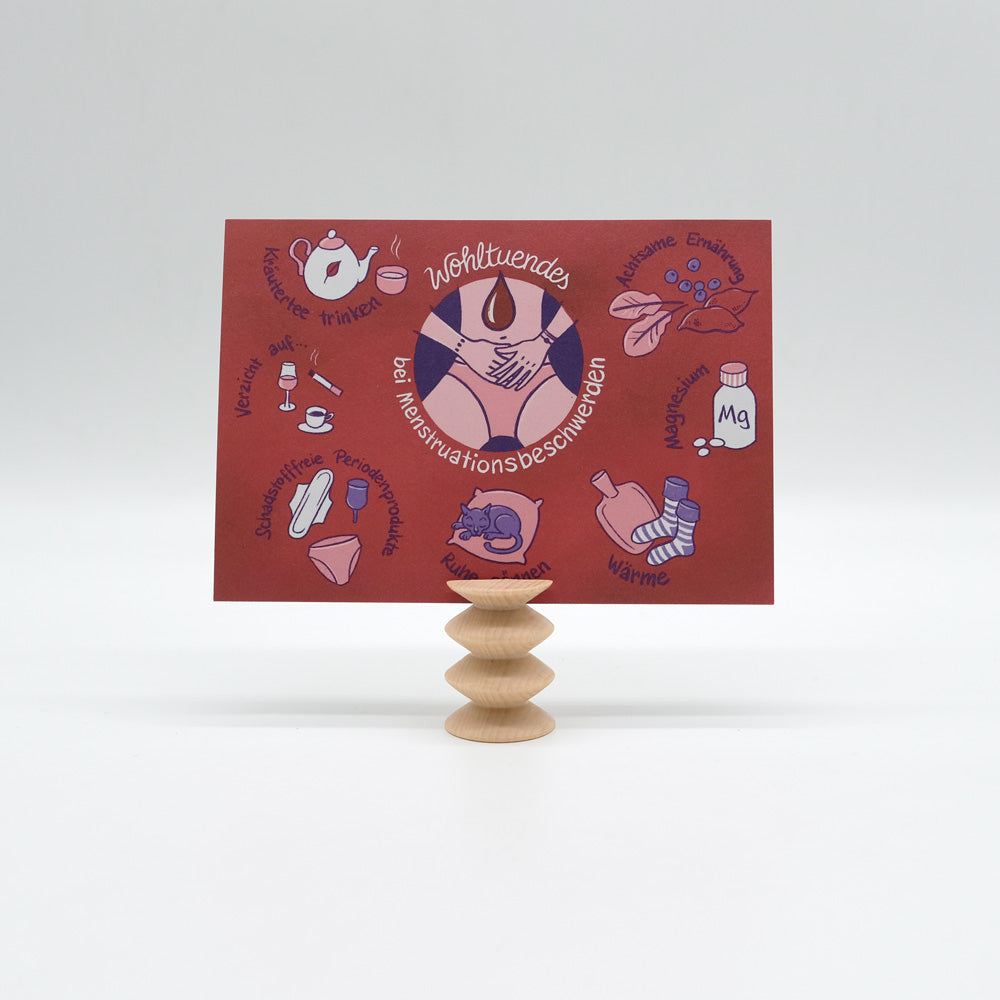 Postkarte "Wohltuendes bei Menstruationsbeschwerden" in Halterung